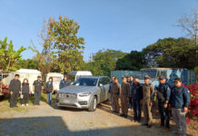 1.2 Billion Baht in Assets Seized in Crackdown on Online Fraud Police officers pose with a seized Volvo car during a raid on Jan. 11, 2024.