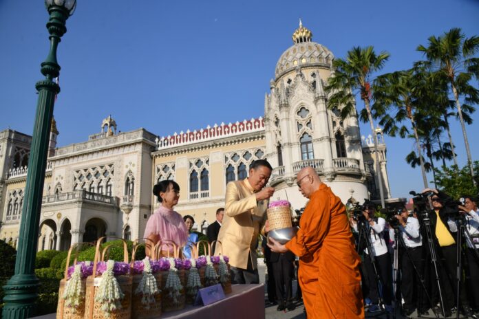 PM Srettha Thavisin and his wife give alms to a monk on the occasion of New Year's Day at the Government House in Bangkok on Jan. 2, 2024. PM Srettha Thavisin and his wife give alms to a monk on the occasion of New Year's Day at the Government House in Bangkok on Jan. 2, 2024.