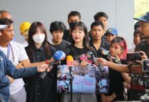 Opinion: Shut From Parliament, Monarchy Reform Issue Reopened on the Streets Monarchy reform activist Tawan Tuatulanond speaks to reporters after she files a complaint at Pathum Wan Police Station over the clash with a group of ultra-royalists at BTS Siam Station earlier the day on Feb. 10, 2024.
