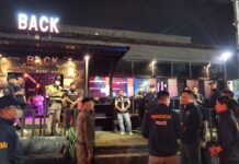 Cops Arrest 7 Illegal Migrant Workers In this undated photo, police inspect a bar during an operation against illegal employment.