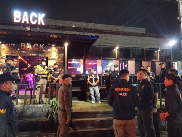 In this undated photo, police inspect a bar during an operation against illegal employment. In this undated photo, police inspect a bar during an operation against illegal employment.