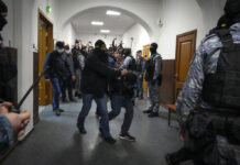 4 Men Charged in Moscow Attack, Showing Signs of Beatings at Court Hearing