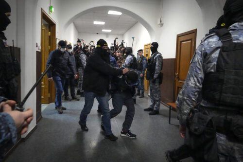 4 Men Charged in Moscow Attack, Showing Signs of Beatings at Court Hearing