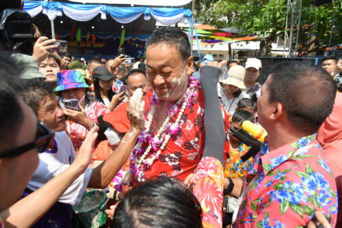 Songkran revelers put powder on PM Srettha Thavisin during the Songkran festival in Hua Hin, Prachuap Khiri Khan province on April 13, 2024.
