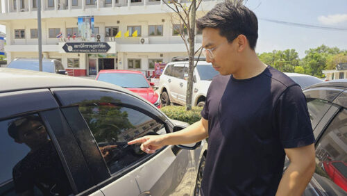 Mr. Tharatit na Pattalung, 33, pointed at his car, which was damaged by an American visitor. 