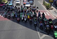 Opinion: Bangkok’s Heat Wave Needs to be Addressed Now Motorcyclists stop in the shade of a skytrain line on a hot day in Bangkok, Thailand, Friday, May 3, 2024. Photo: Sakchai Lalit / AP