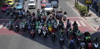 Opinion: Bangkok’s Heat Wave Needs to be Addressed Now Motorcyclists stop in the shade of a skytrain line on a hot day in Bangkok, Thailand, Friday, May 3, 2024. Photo: Sakchai Lalit / AP