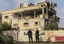 Attack on Central Israel Injures 11 As Iran’s Leader Promises a Punishing Response