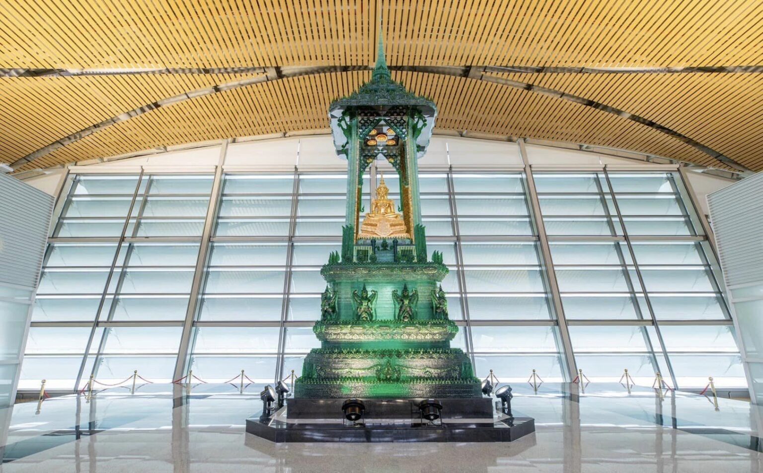 The Buddha image in the Subduing Mara posture is located at the eastern end of Suvarnabhumi Airport's SAT-1.