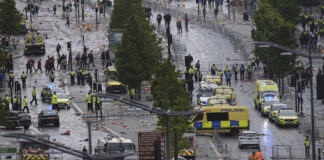 Driver Arrested After Car Plows into Celebrating Liverpool Fans