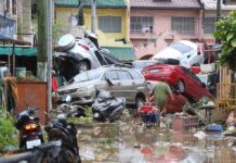 Fatal Typhoon Traps People on Roofs and Submerges Cars in Central Philippines