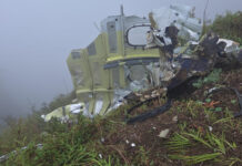 Indonesian rescuers find a body near wreckage of a plane that crashed with 10 aboard