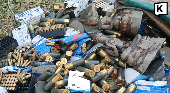 Ammo and Buddha Bullets and Buddha statues found in Thai roadside ditch