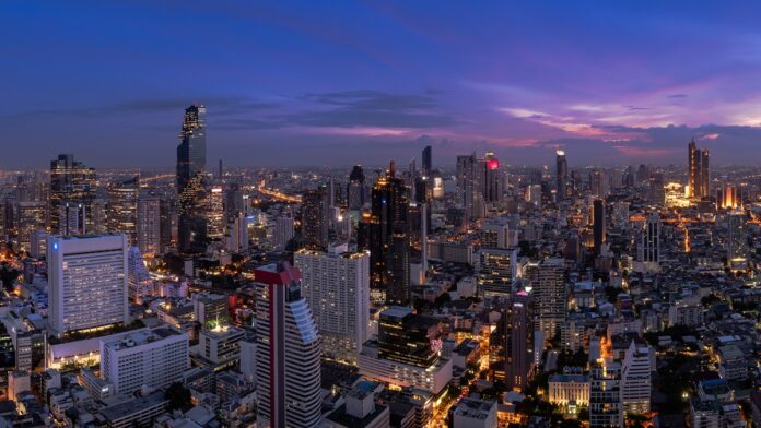Bangkok business district cityscape with skyscraper at twilight,