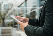 Finding an AI Search Optimisation Agency in Thailand A man using AI search on his mobile