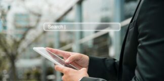 Finding an AI Search Optimisation Agency in Thailand A man using AI search on his mobile