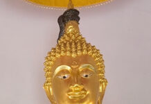 Python found coiled around Buddha statue in Nakhon Nayok Python found coiled around Buddha statue in Nakhon Nayok