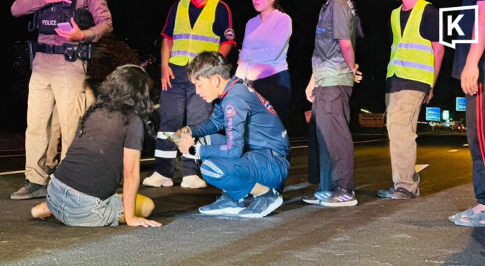 Drunk woman sits in road, narrowly avoids traffic hits Drunk woman sits in road, narrowly avoids traffic hits