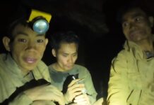 Rescuers work to drain flooded Laos cave to free 5 villagers and search for 2 still missing