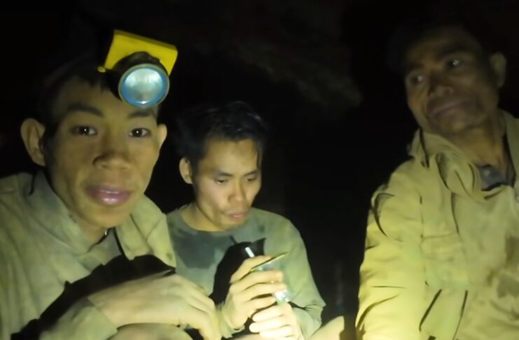Rescuers work to drain flooded Laos cave to free 5 villagers and search for 2 still missing