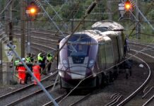 Two trains collide north of London, killing at least 1 person and seriously injuring dozens