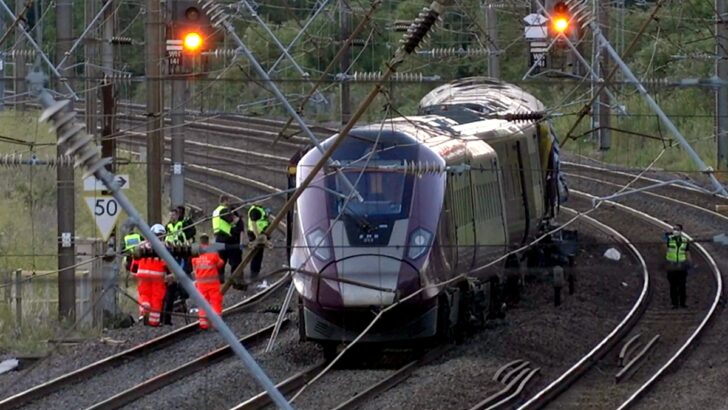 Two trains collide north of London, killing at least 1 person and seriously injuring dozens