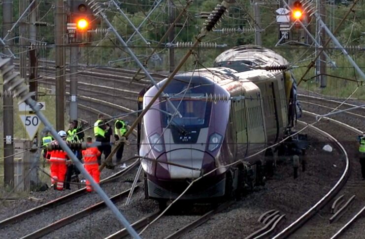 Two trains collide north of London, killing at least 1 person and seriously injuring dozens