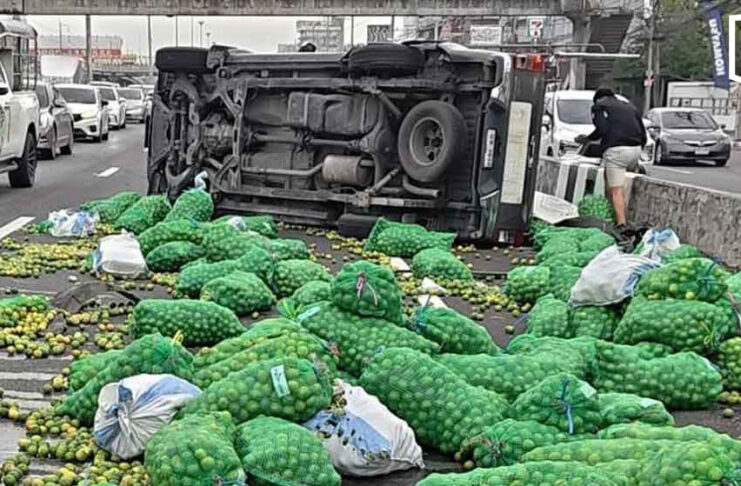 Lorry overturns after tyre blowout, spilling 100 sacks of limes across road Lorry overturns after tyre blowout, spilling 100 sacks of limes across road