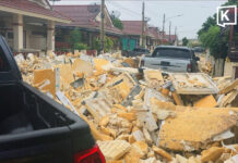 Village wall collapses in Chonburi after foam waste washed into homes