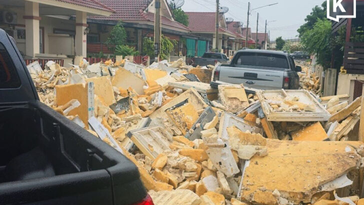 Village wall collapses in Chonburi after foam waste washed into homes