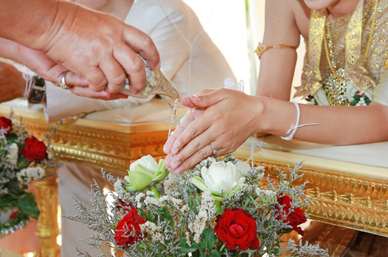 hand bride receiving holy water from elders thai culture wedding ceremony
