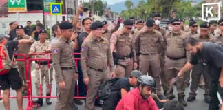Two hurts as protesters clash with police at China consulate