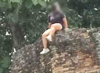Chinese tourist criticised for sitting atop Chiang Mai ancient city wall Chinese tourist criticised for sitting atop Chiang Mai ancient city wall