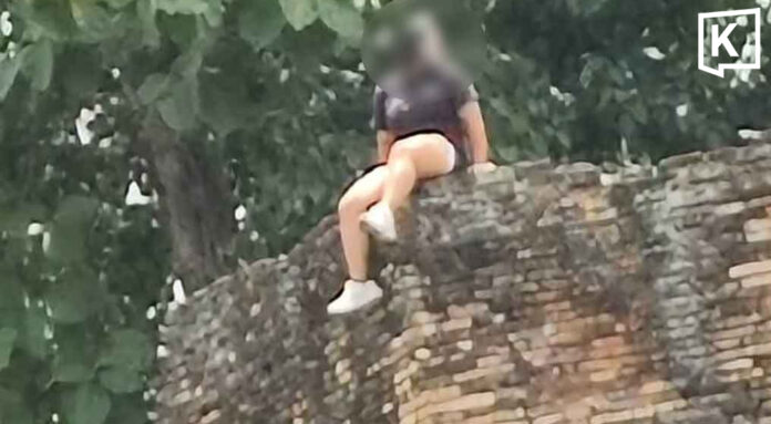 Chinese tourist criticised for sitting atop Chiang Mai ancient city wall Chinese tourist criticised for sitting atop Chiang Mai ancient city wall