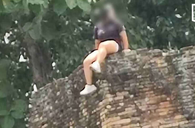 Chinese tourist criticised for sitting atop Chiang Mai ancient city wall Chinese tourist criticised for sitting atop Chiang Mai ancient city wall