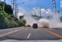 White smoke engulfs Phuket road after pickup truck breaks down