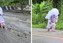 ‘Astronaut’ walks on crater-like road in Kanchanaburi ‘Astronaut’ walks on crater-like road in Kanchanaburi