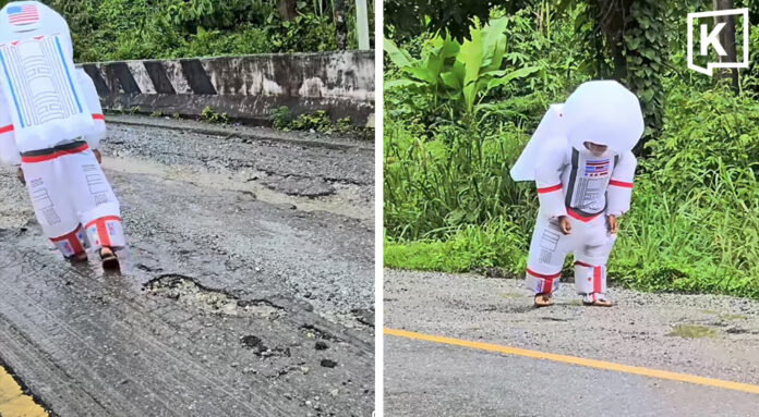 ‘Astronaut’ walks on crater-like road in Kanchanaburi