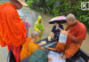 Monks traverse floodwaters to deliver relief supplies in Pak Chong; troops, rescuers evacuate patient weighing over 100 kg
