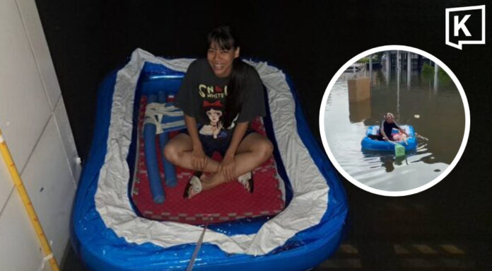 Athletes turn inflatable pool into boat amid Bangkok floods Athletes turn inflatable pool into boat amid Bangkok floods