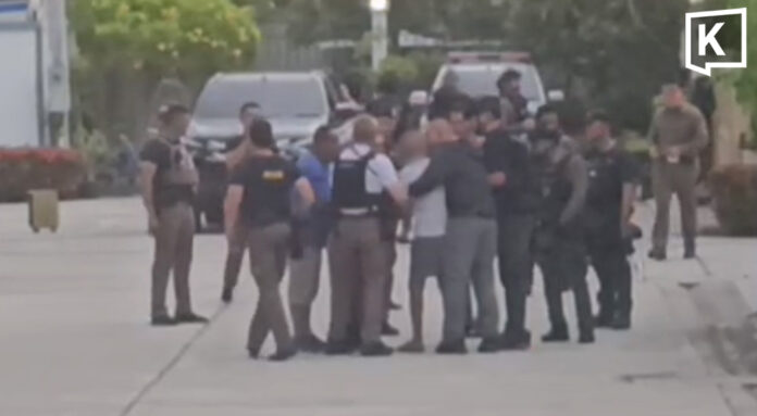 Police officer who shot his wife arrested after overnight standoff Police officer who shot his wife surrenders after overnight standoff