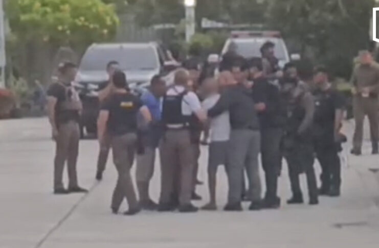 Police officer who shot his wife surrenders after overnight standoff Police officer who shot his wife surrenders after overnight standoff