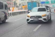 White Mercedes drives wrong way on Bangkok’s Vibhavadi Road White Mercedes drives wrong way on Bangkok’s Vibhavadi Road