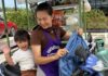 Baby joins mum on her daily noodle-selling rounds