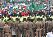 Shipping containers return to Bangkok streets as farmers protest IMF-World Bank meetings