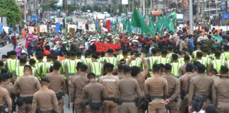 Shipping containers return to Bangkok streets as farmers protest IMF-World Bank meetings