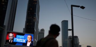 Israelis vote in a tense national election seen as a referendum on Netanyahu