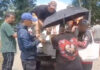 Parents carry autistic son in basin through floodwaters to reach hospital Parents carry autistic son in basin through floodwaters to reach hospital