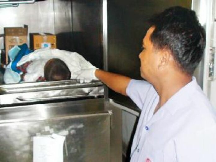 Hospital official identifying dead body of the victim.