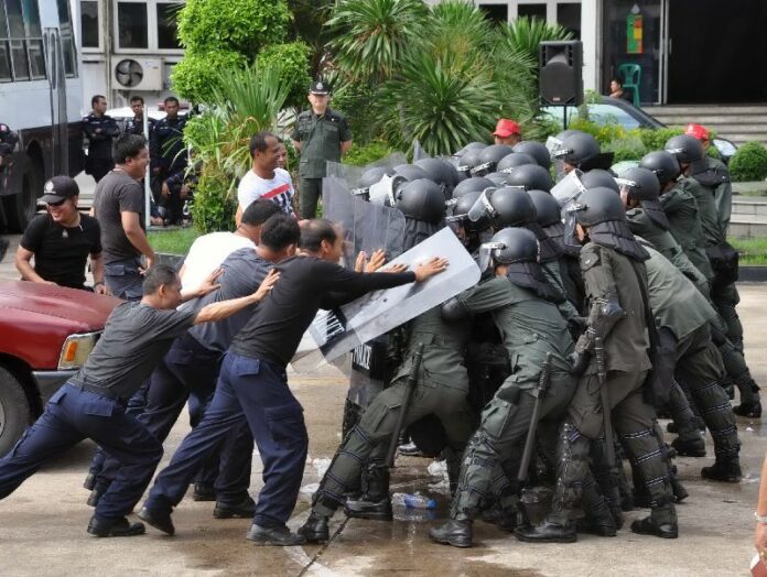 Riot police rehearsing crowd control tactics on 31 July in Bangkok, ahead of upcoming anti-government protests.